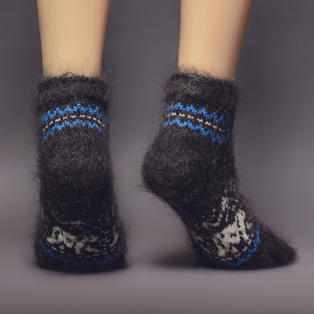 Dark low-cut wool socks relaxed fit with white and blue polar bear design - back view.