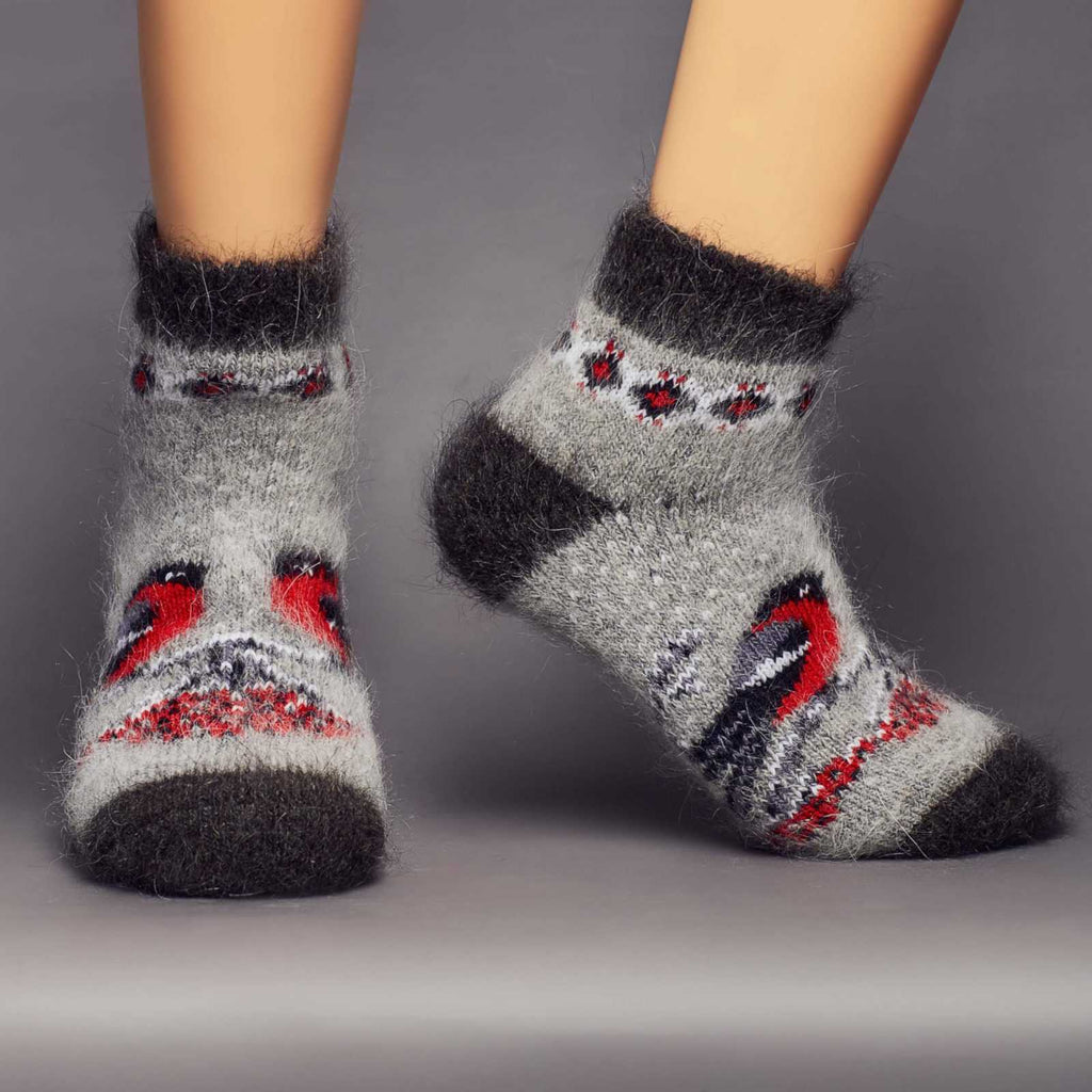 Warm goat hair grey black home socks with red birds and berries - front view.