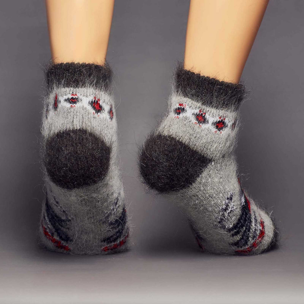 Warm goat wool grey black home socks with red birds and berries - back view.