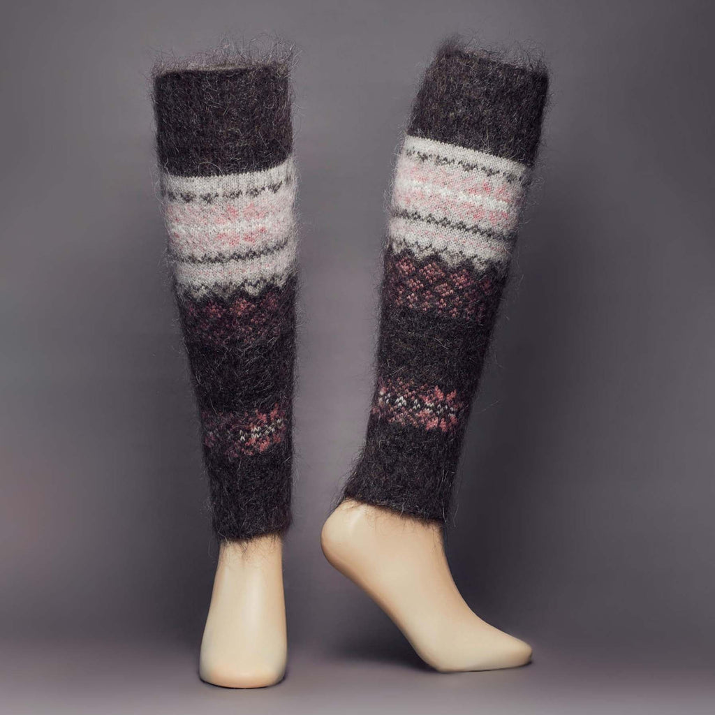 Warm goat hair black and grey leg warmers with pink snowflakes - front view.