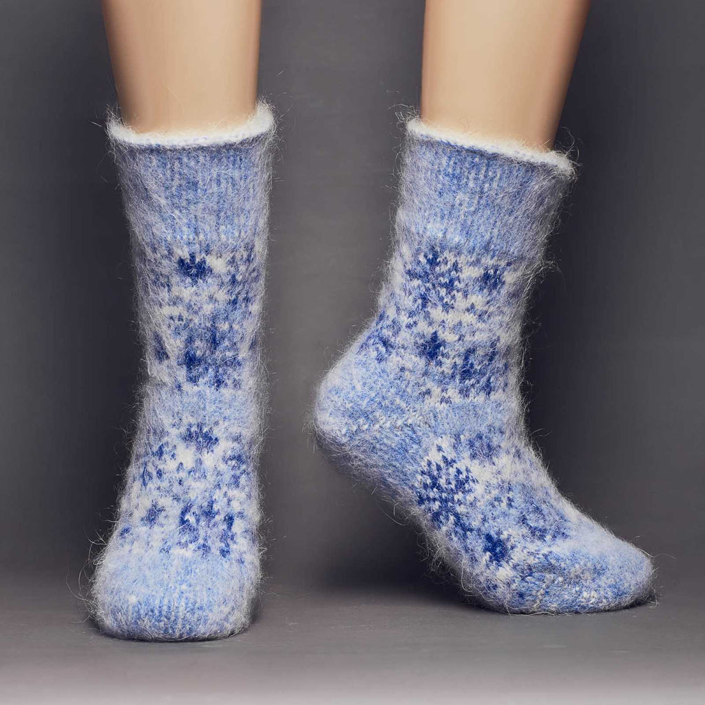 Extra thick goat hair blue and silver snowflake crew socks relaxed fit - front view.