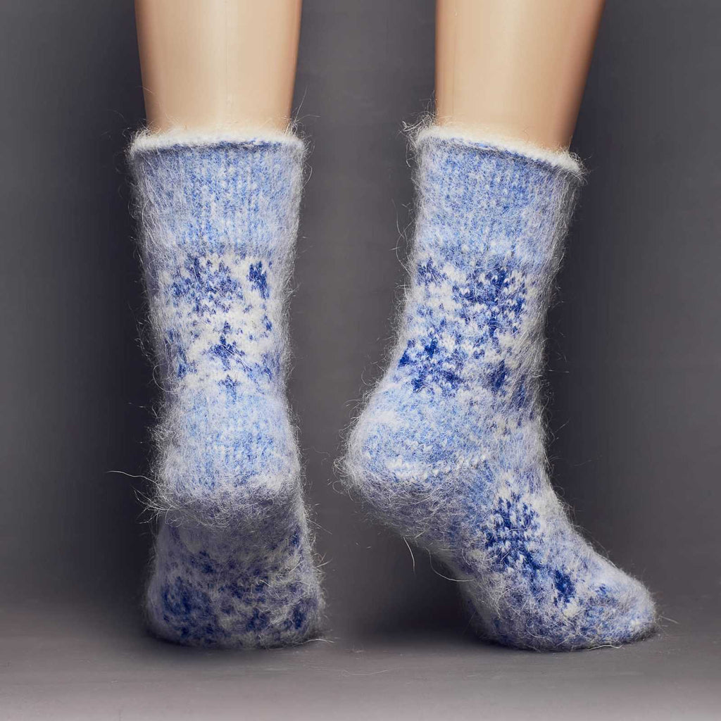 Extra thick goat hair blue and silver snowflake crew socks relaxed fit - back view.