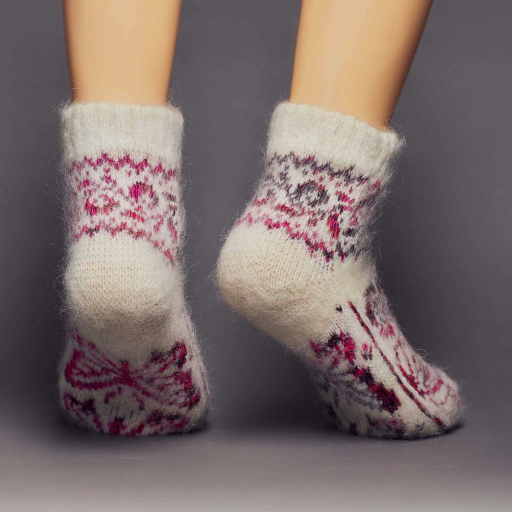 Thick fuzzy goat hair low-cut home off-white socks with pink butterflies - back view.