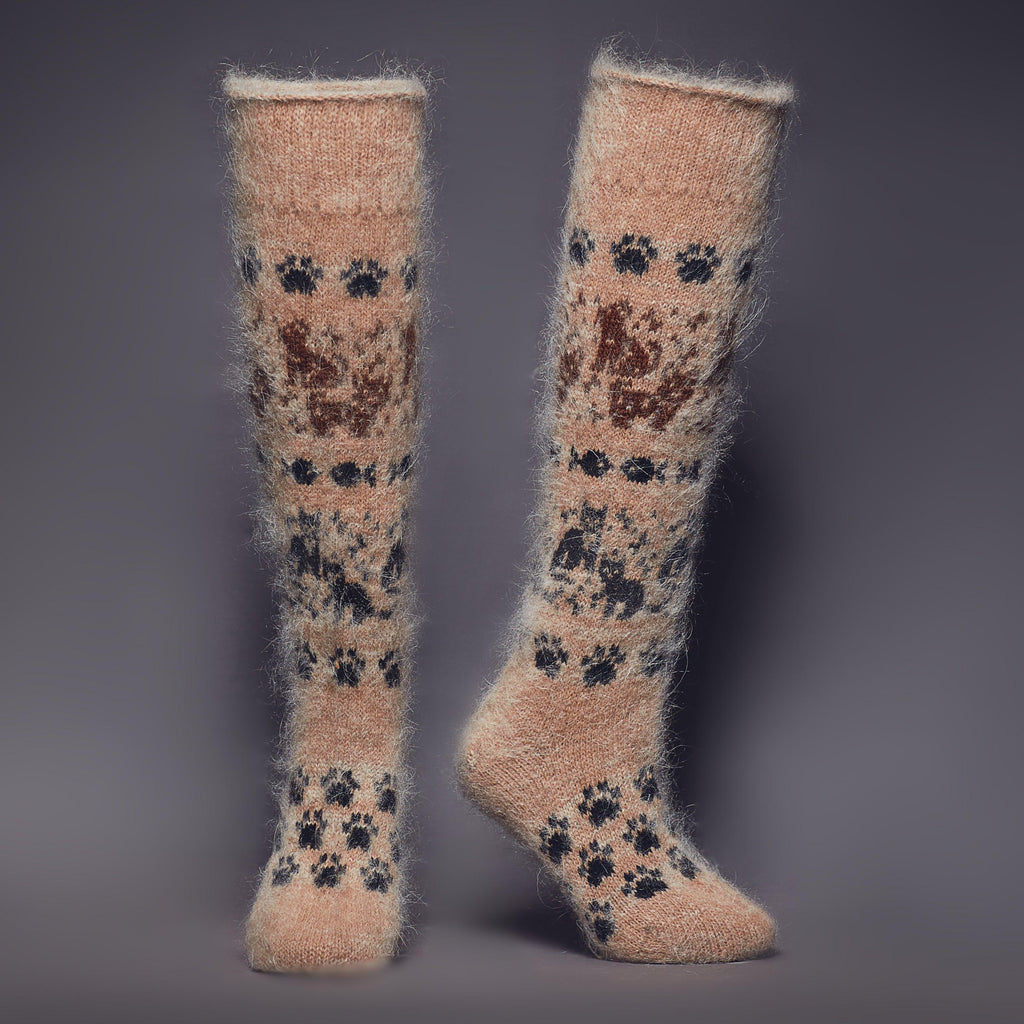 Light-brown knee-high wool socks with brown black cat and dog design - front view.