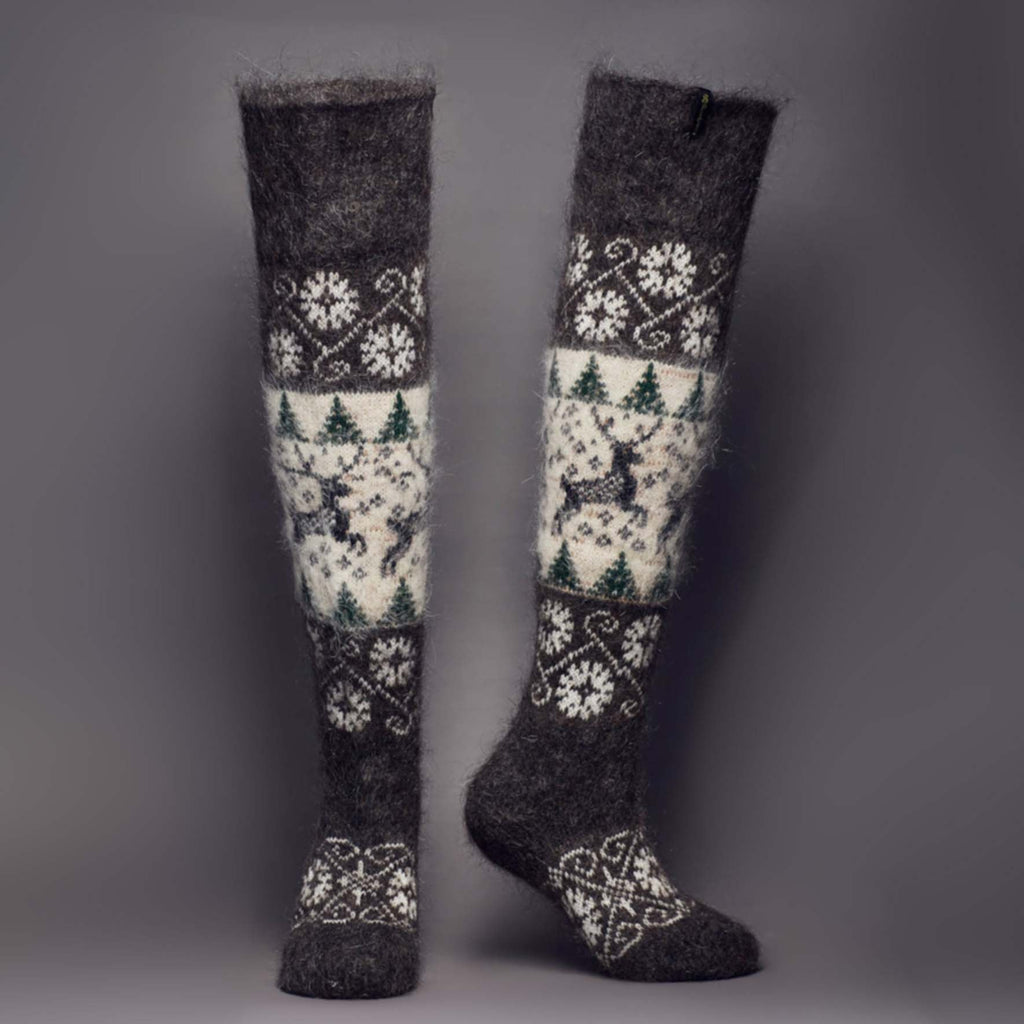 Over-the-knee warm goat hair charcoal and white socks with deer and trees design - front view.
