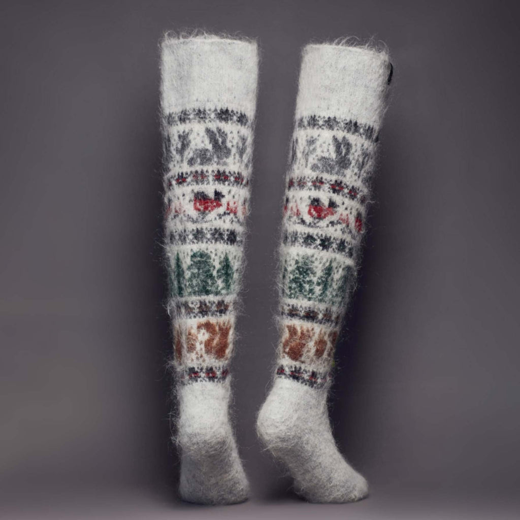 Fuzzy goat wool over-the-knee light grey socks with birds, bunnies, and squirrels - back view.