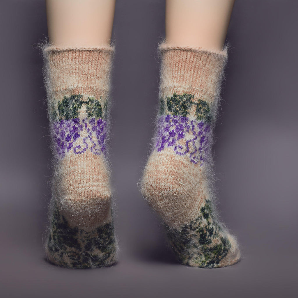 Goat hair crew length relaxed fit socks beige color with a purple and green grape design - back view.