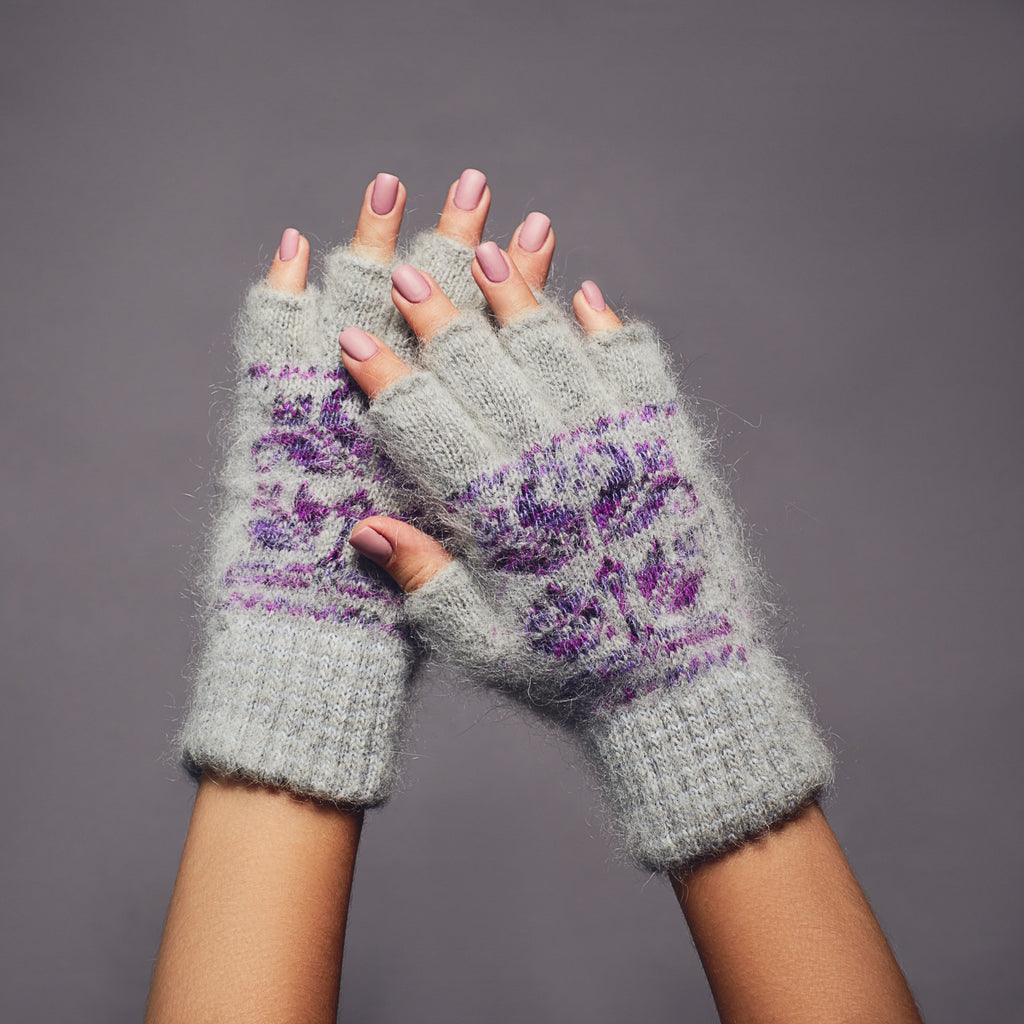 Light-gray goat wool fingerless gloves with a purple flower design.