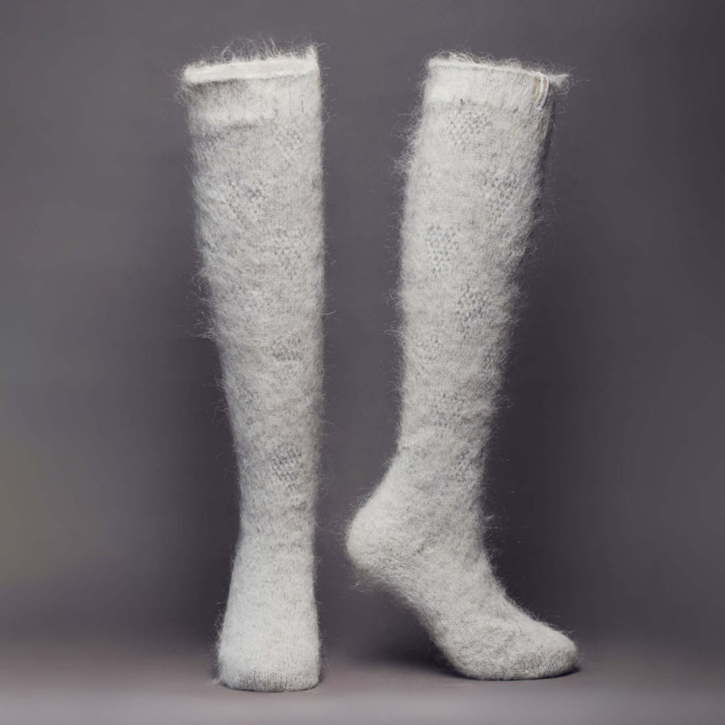 Grey knee-high fuzzy goat hair socks - front view.