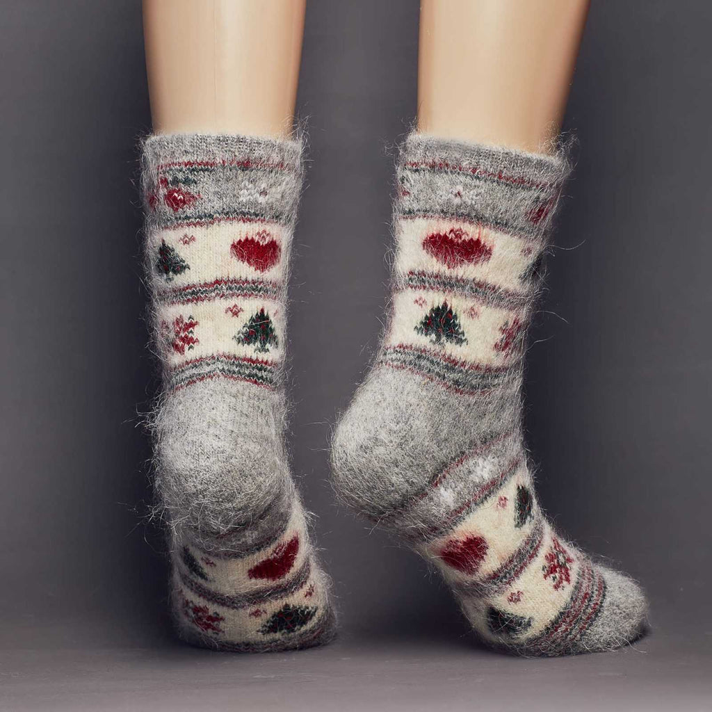 Christmas holidays goat wool warm thick socks crew length with heats, poinsettia, and trees -back view.