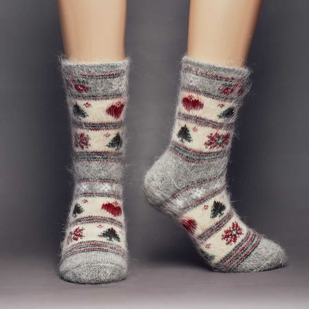 Christmas holidays goat hair warm thick socks crew length with heats, poinsettia, and trees - front view.