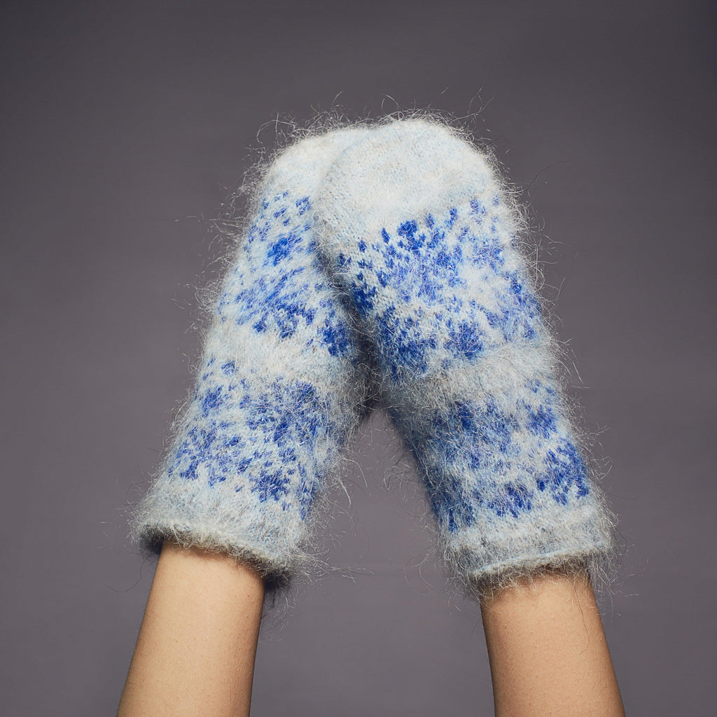Goat hair warm light blue mittens with a blue snowflake design.