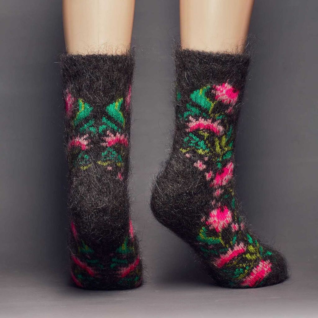 Fuzzy black goat hair thick crew socks with pink peonies and green leaves - back view.