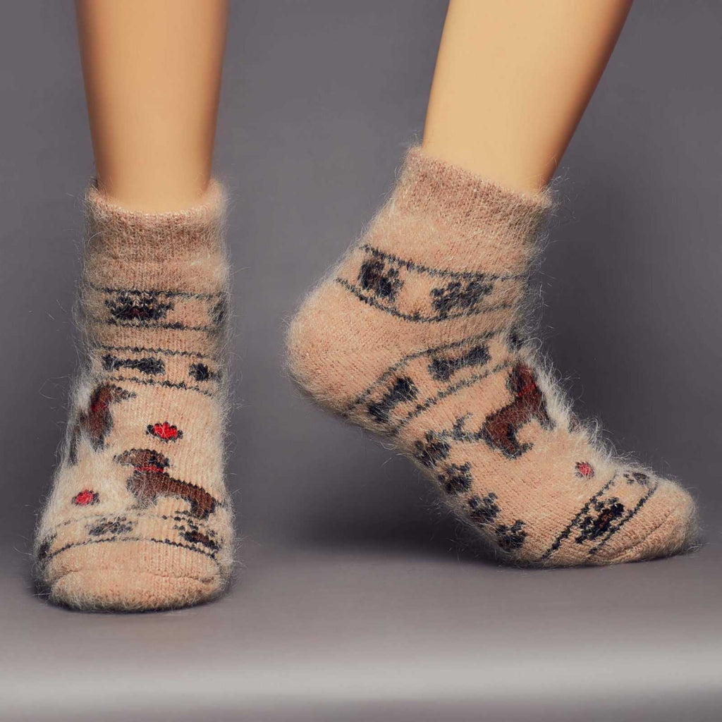 Low-cut wool light brown socks with puppies and paw prints - front view.