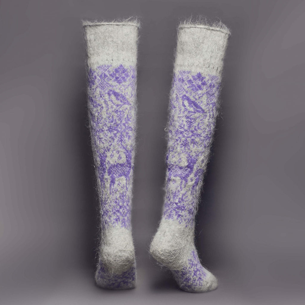 Pair of warm goat wool grey and purple over-the-knee socks with a deer and snowflake design - back view.