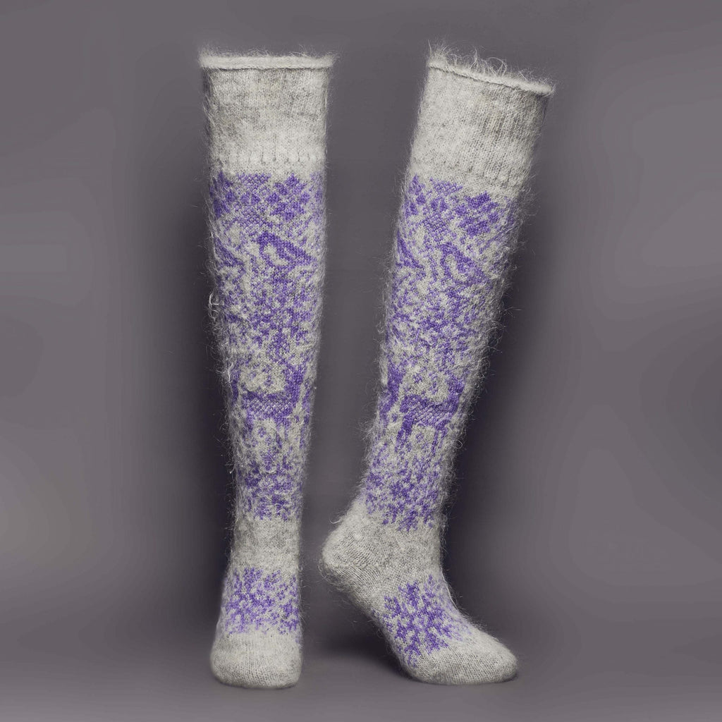 Warm goat hair grey and purple over-the-knee socks with a deer and snowflake design - front view.