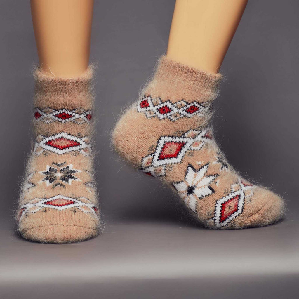 Warm thick goat wool light-brown socks with a western design - front view.